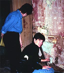 Conservators taking paint samples from the walls of 97 Orchard Street