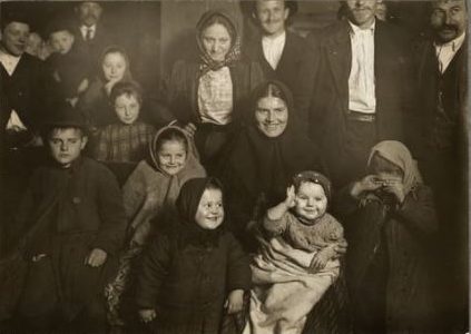 A group of Slavic immigrants register many shades of emotion. The baby salutes his new home - quite a family group. Photo-study by Lewis W. Hine