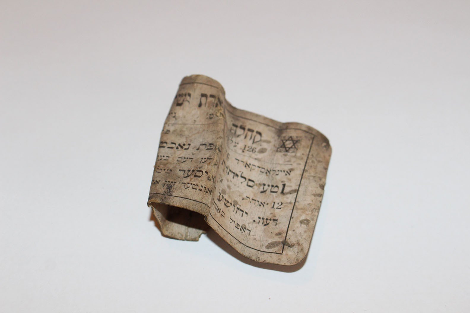Small bit of paper with Hebrew writing found at 97 Orchard Street