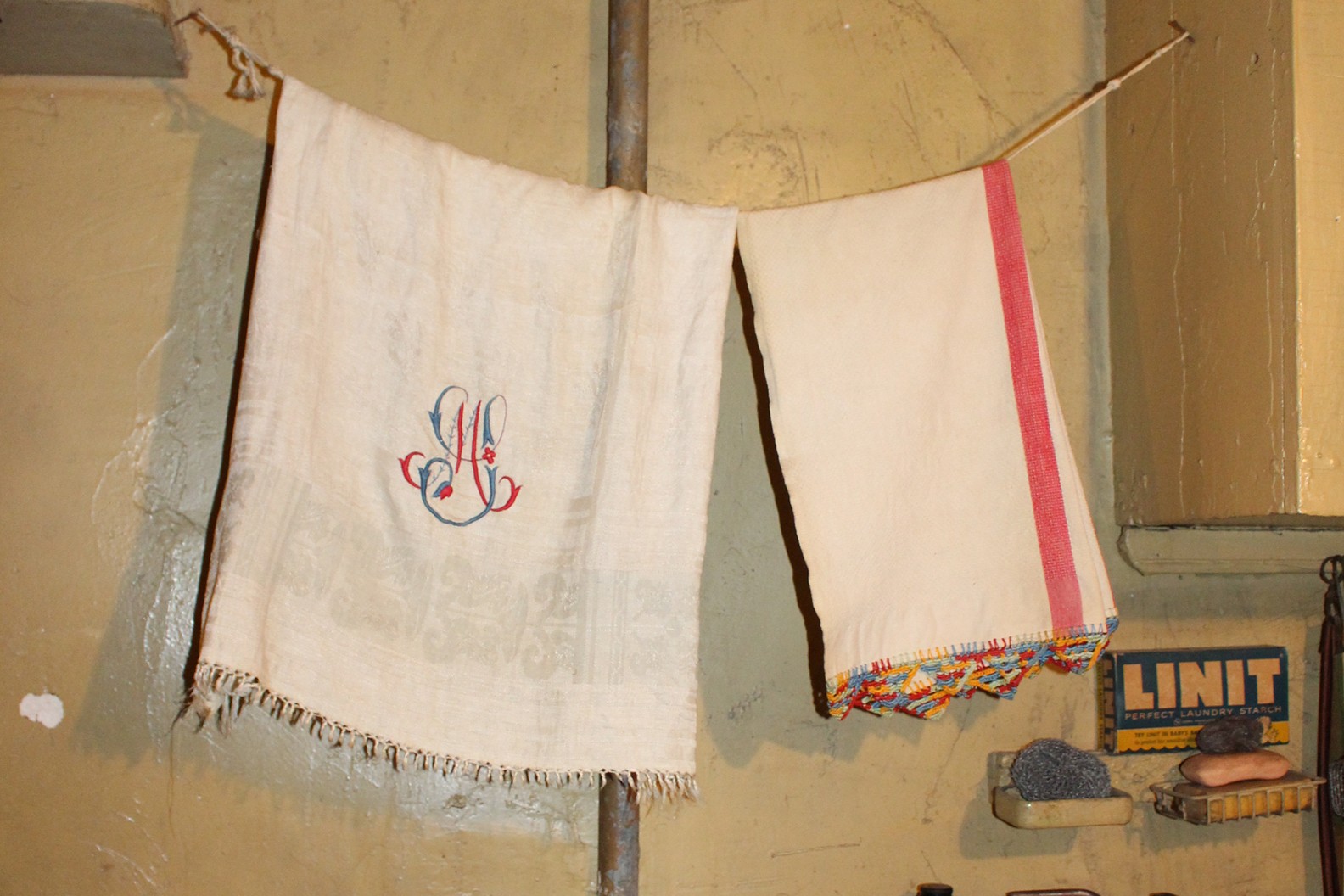 Dish towels hanging on a line in the recreated Baldizzi kitchen