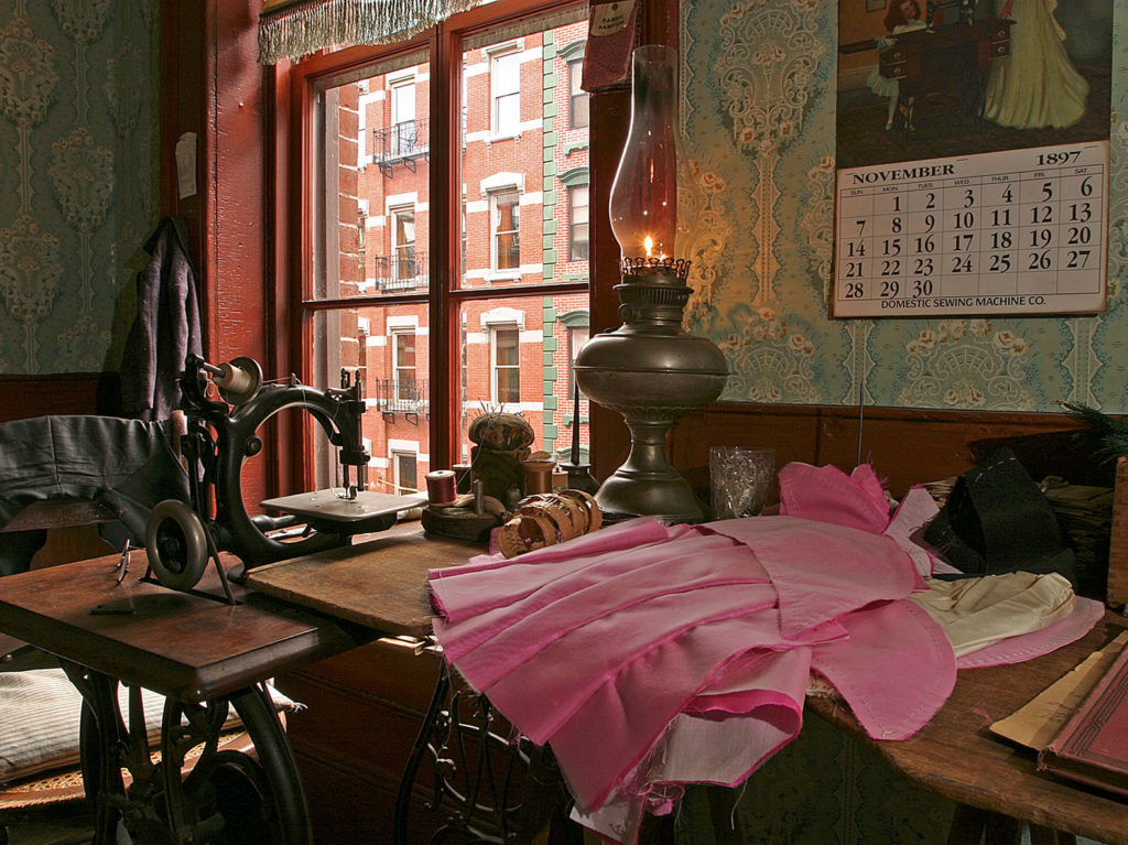 The Levine sewing table inside the parlor of their recreated apartment at 97 Orchard Street
