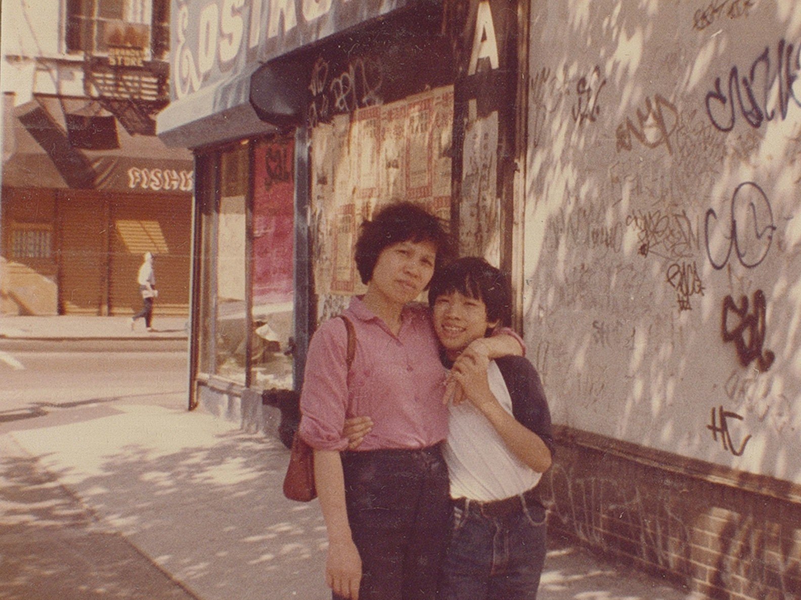 Mrs Wong and Kevin in front of their home on Delancey Street circa 1980