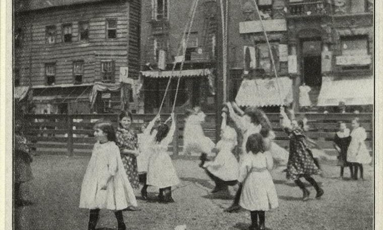 Girls dance around a maypole in Seward Park, 1890s