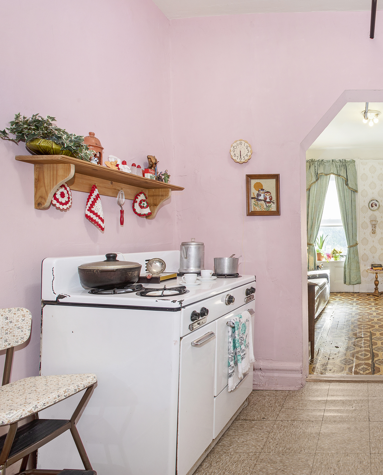 Tenement Room with pink wall and stove