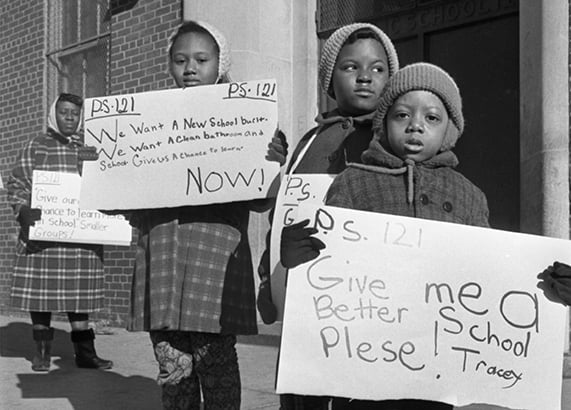 Black and white photo of children picketing