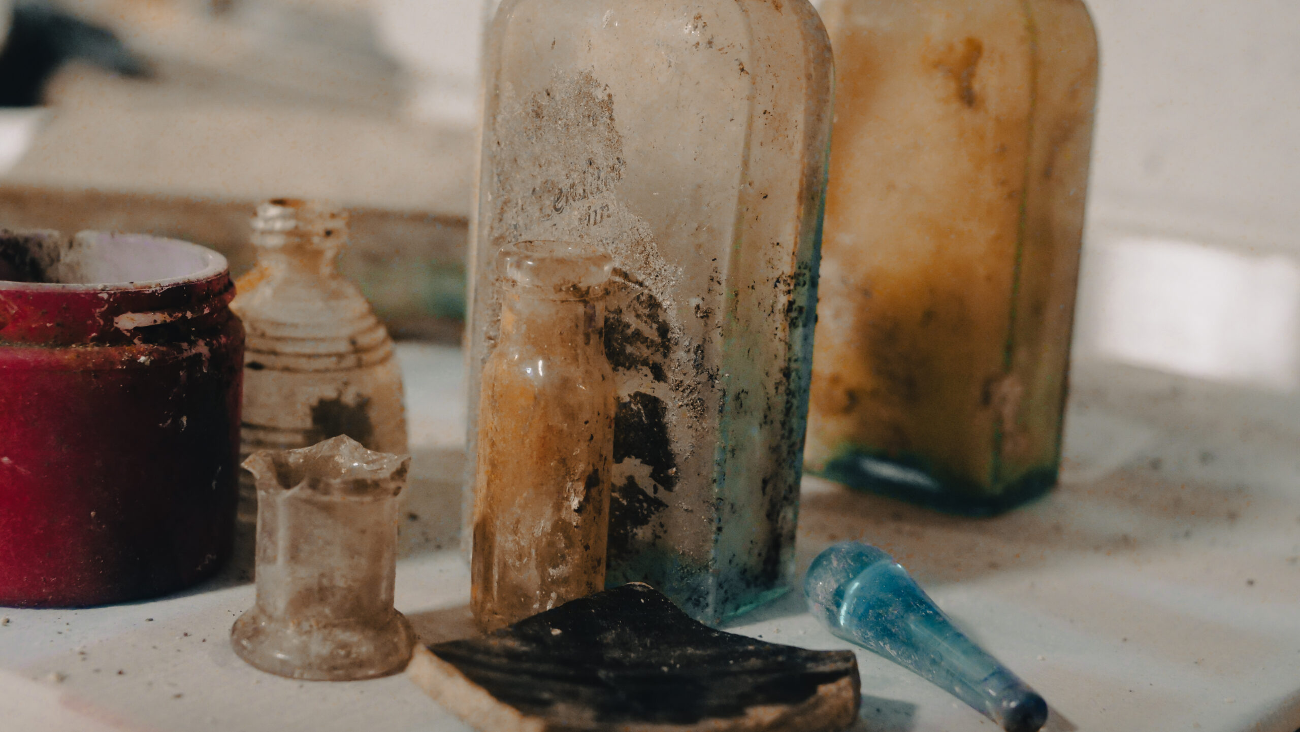 assorted antique glass bottles