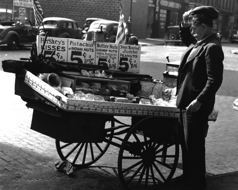 Black and White photo of man and pushcart