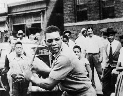The great Willie Mays playing a game of stickball in NYC.